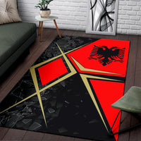 Large area rug in black and red with Albanian eagle, gold star outline and shards