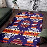 Purple patterned area rug with repeating aztec-style squares and zigzag accents in orange and navy