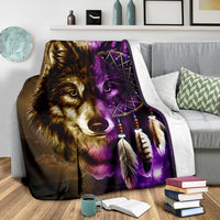 Wolf face with purple dreamcatcher, feathers, and multicolor design on blanket