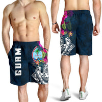 Men's blue Guam swim shorts on model, elastic waist and tropical side print