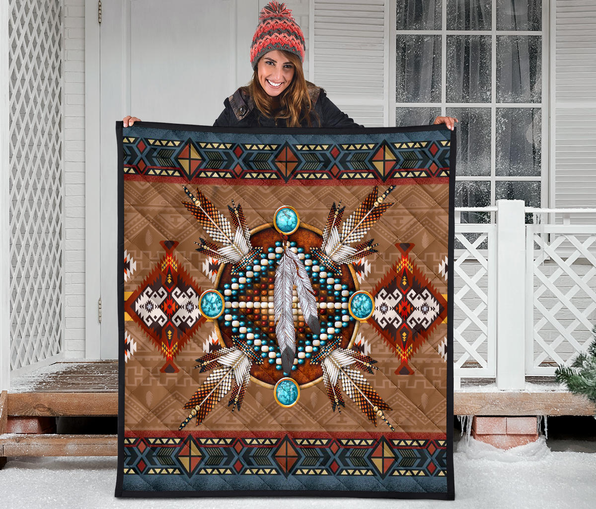 Native pattern brown quilt featuring turquoise bead circles around a white feather motif