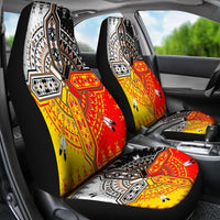 Front seat covers in black, red, and yellow with medicine wheel motif and arrows
