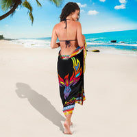 Black sarong back view with colorful diamond pattern and striped border trim