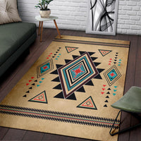 Southwest area rug with bold central diamond star design and triangle border on tan