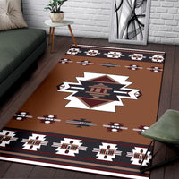 Rust-brown geometric area rug with bold accents and large white starburst center
