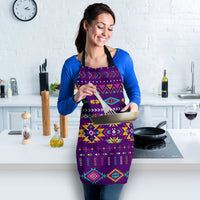 Purple colorful geometric apron with black straps, worn with long sleeves