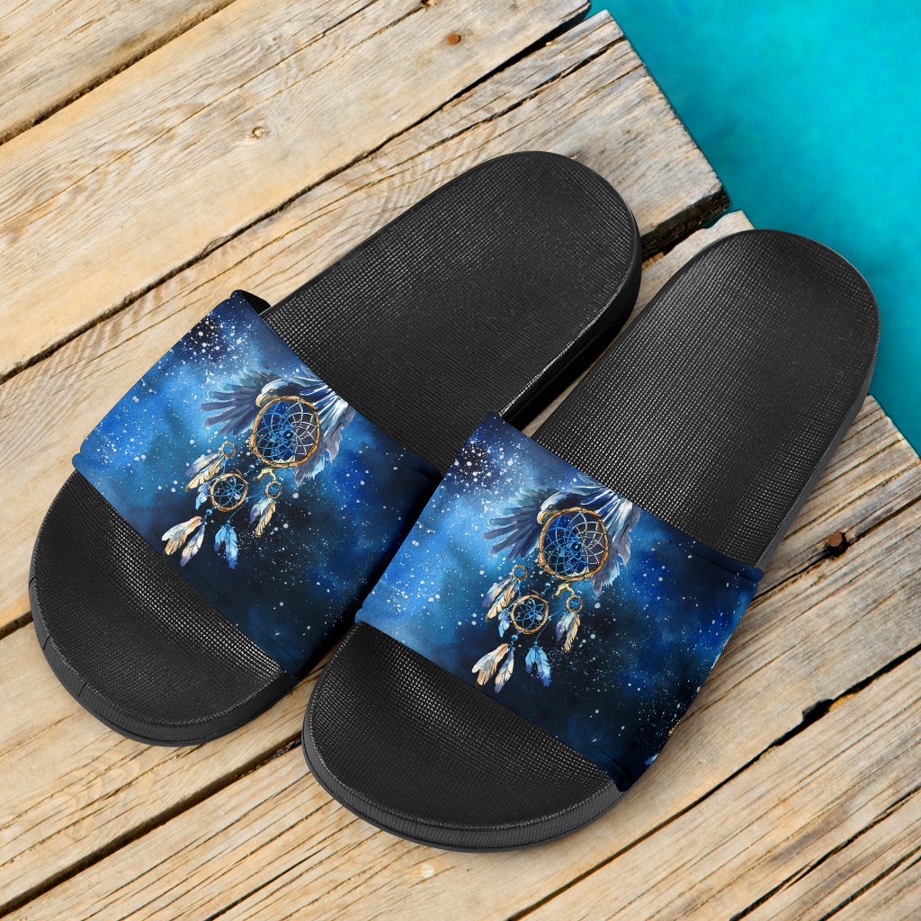 Pair of blue galaxy dreamcatcher slide sandals with black textured sole