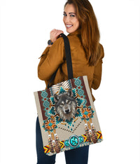 Wolf face mandala tote bag with beadwork details, multicolor print and black handle