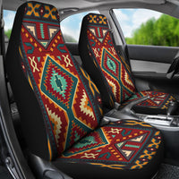 Front seat covers with bold Native American geometric design in red, teal, and yellow