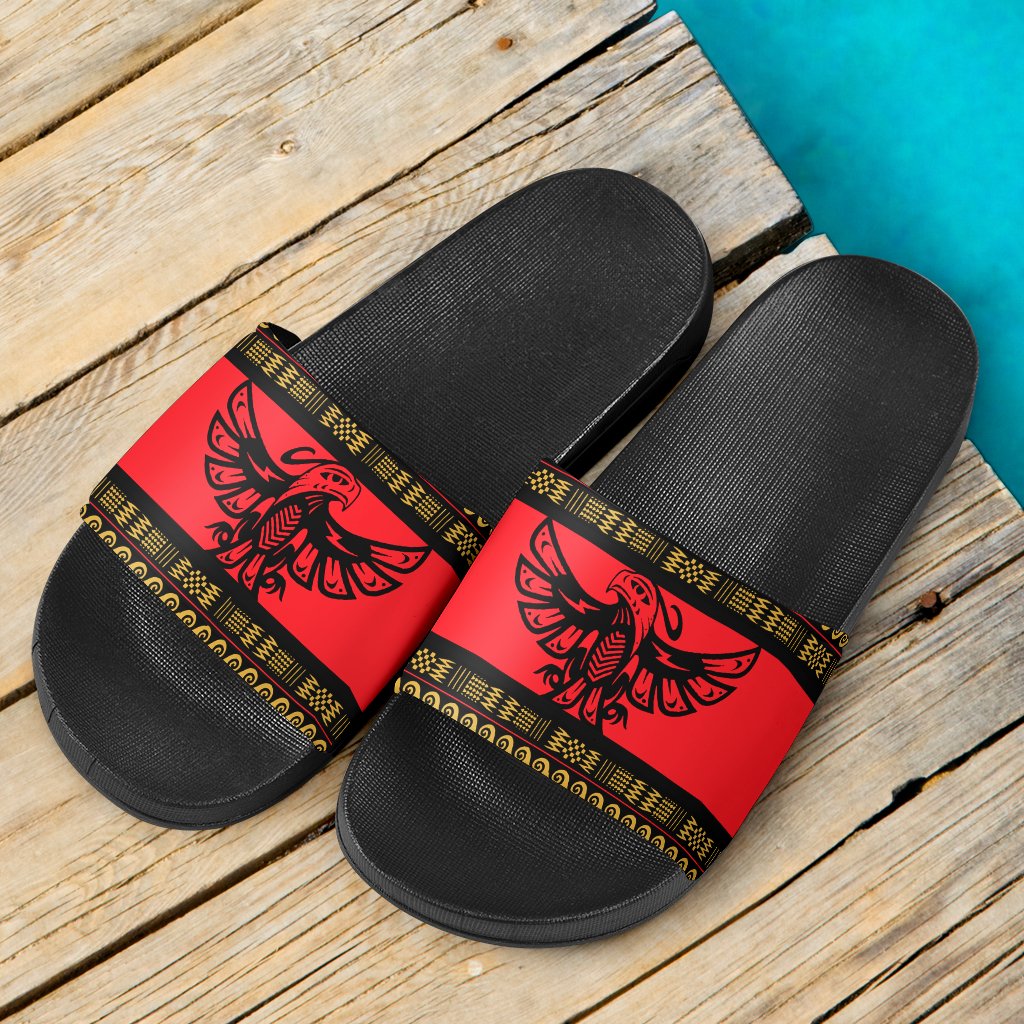 Pair of slide sandals: black textured footbed, red strap with black bird pattern and gold border