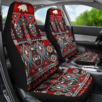 Car seat covers installed: tall back panels and matching seat mats with red bison geometric print