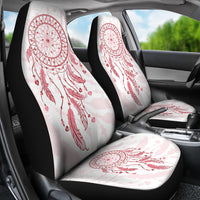 Front and back seat covers with pink dream catcher art on light fabric, black borders