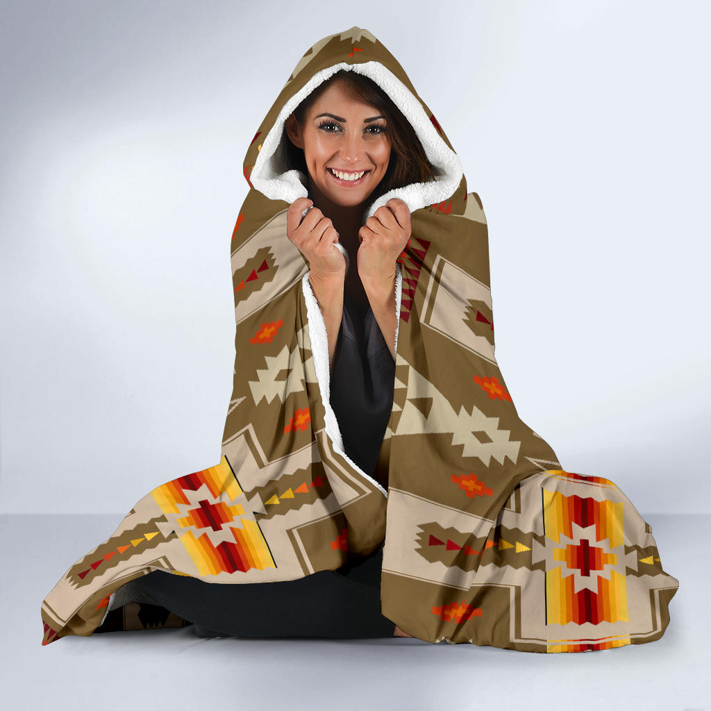 Hooded blanket with white fleece lining and Native American geometric print