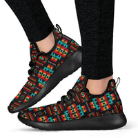 Multicolor native pattern mesh knit sneakers on feet, black rubber sole