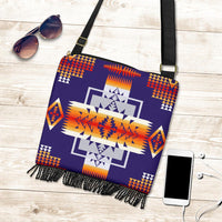 Purple tribal print crossbody pouch with fringe edge, black strap and gold buckle