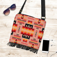 Tribal pattern crossbody handbag with fringe tassels, black strap and gold buckle, tan