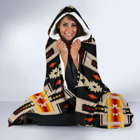 Hooded blanket with white fleece hood lining and black multicolor geometric print