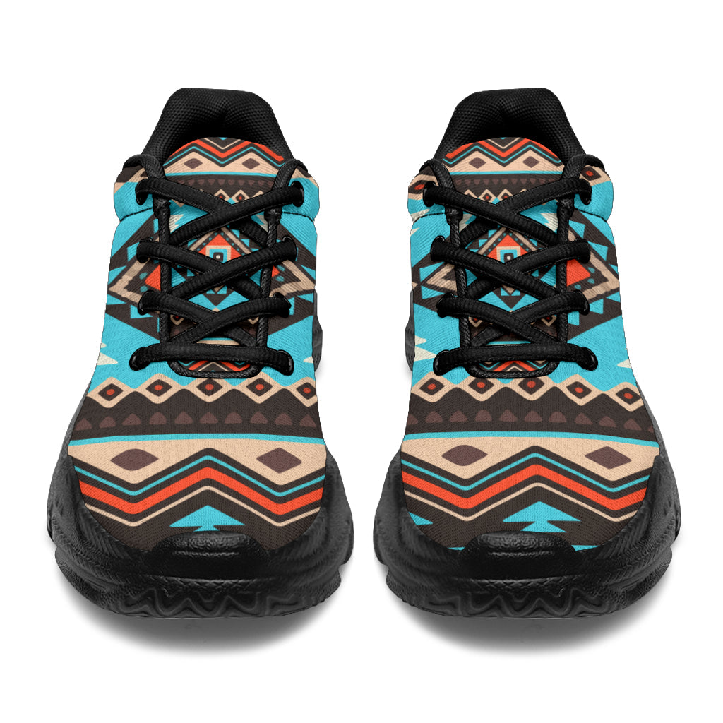 Back view pair of chunky sneakers in turquoise geometric print with black heel tabs