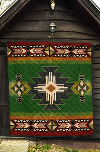 Green Southwest quilt with Native geometric patterns, star medallion, and red edge