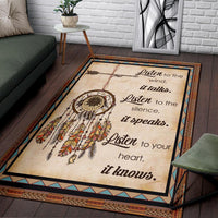 Beige Native-style area rug angled view with dreamcatcher, feathers, and text callout design