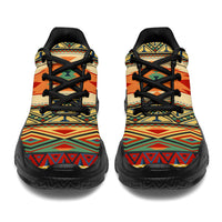 Front view of native geometric chunky sneakers with black laces, beige patterned upper, dark rubber sole