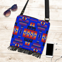 Dark blue tribal crossbody handbag with multicolor geometric pattern and tassel fringe
