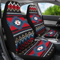 Ornamental multicolor seat covers in a vehicle: red blue zigzag pattern on front seats