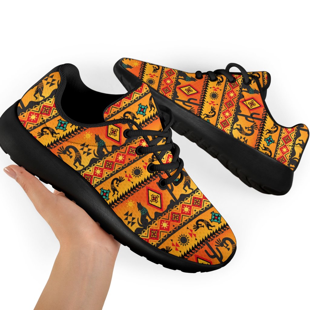 Pair of native motif sport sneakers with black laces and cushioned sole, angled view