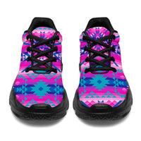 Front view of pink and teal geometric chunky sneakers with black laces and sole