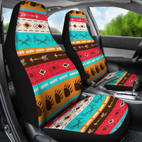 LT10 multicolor front seat covers in car, tribal pattern with guitar icons