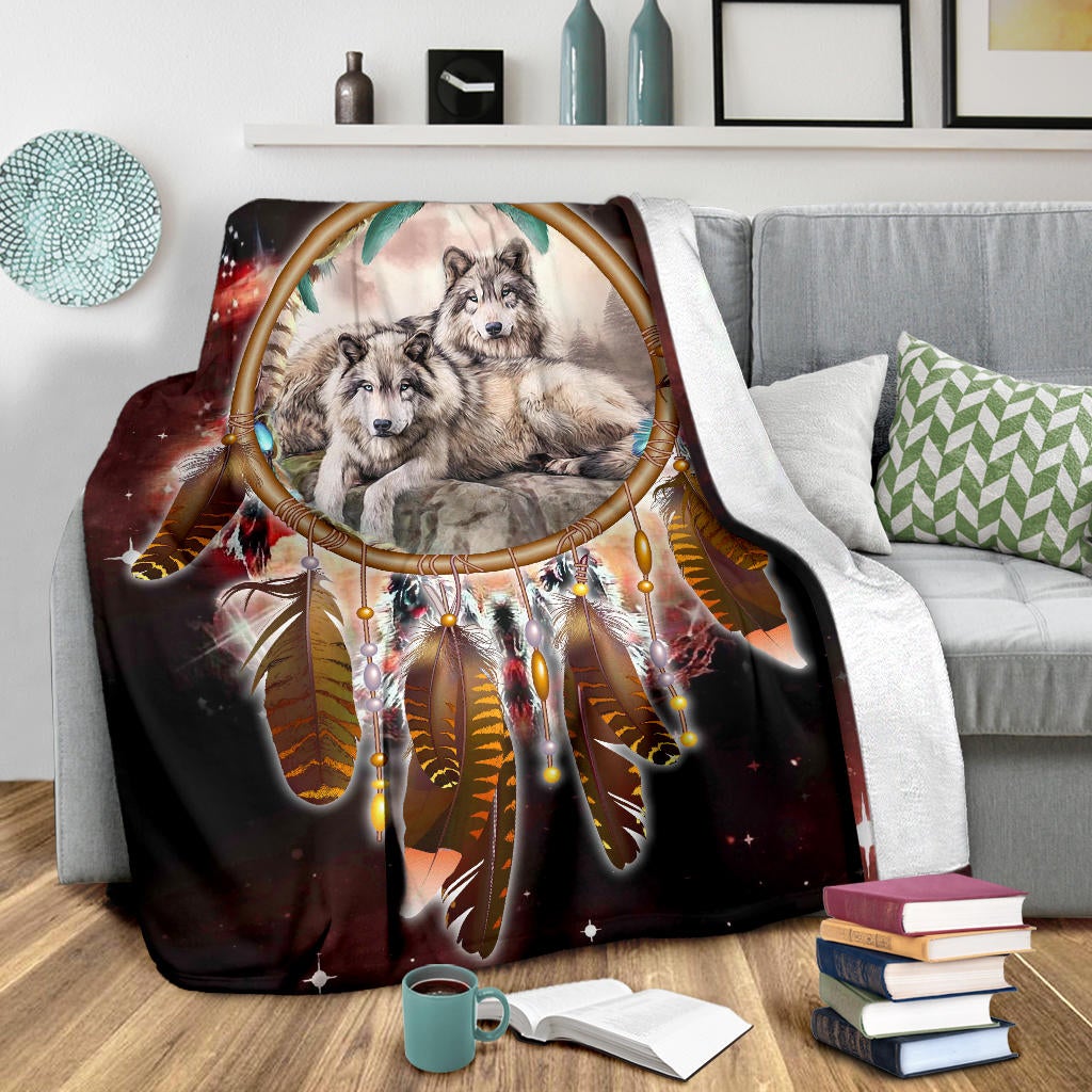 Red and dark galaxy wolf blanket featuring dreamcatcher center and feathered charm details