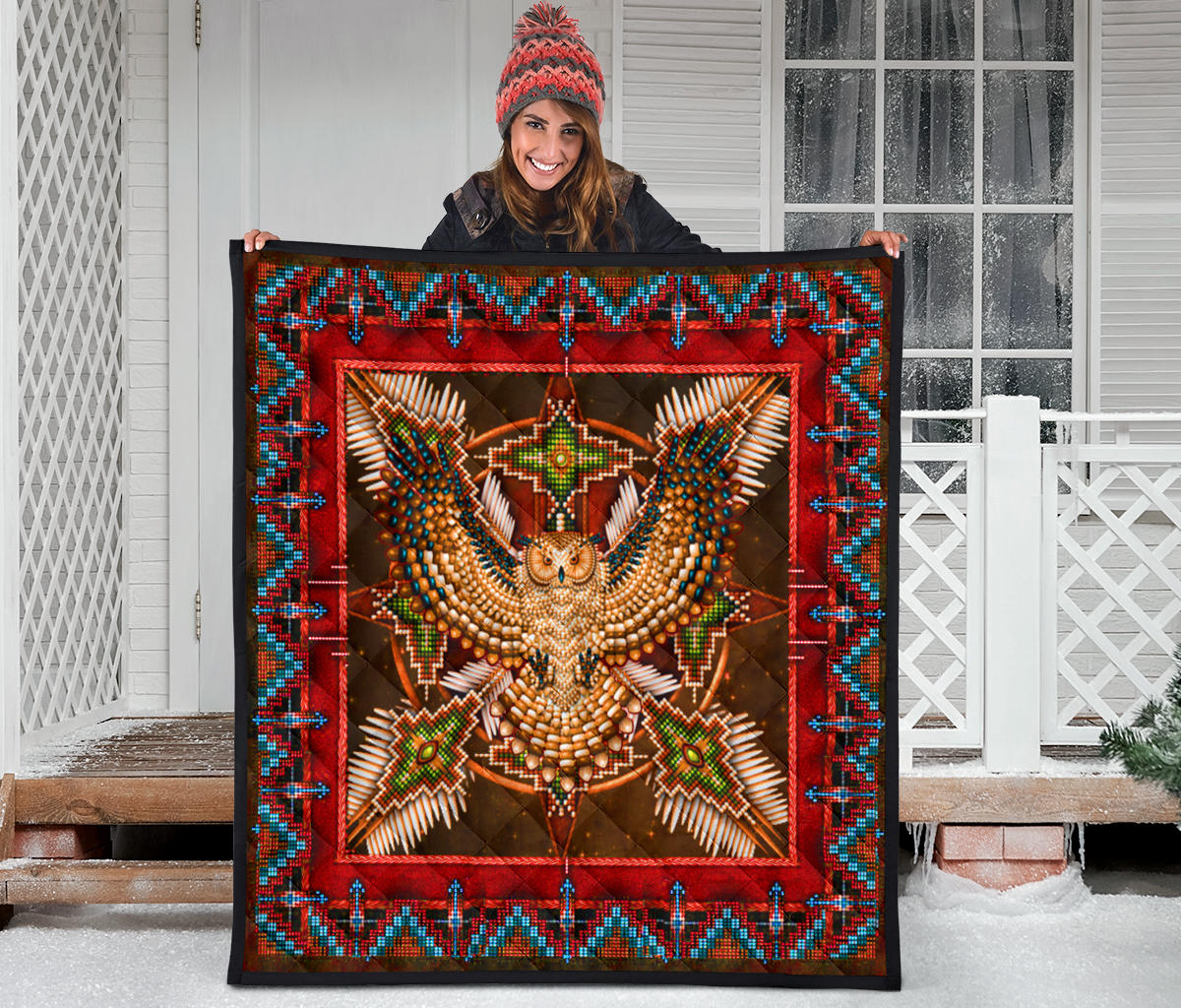 Multicolor Native-style quilt with red frame and centered owl-and-star beadwork design