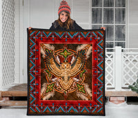 Multicolor Native-style quilt with red frame and centered owl-and-star beadwork design