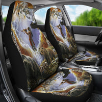 Car seat covers with multicolor wolf-and-hunter print on seat and headrest; black sides