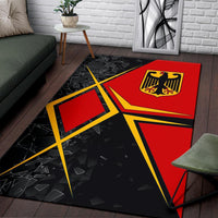 Germany area rug featuring red shield emblem on black background with yellow intersecting lines