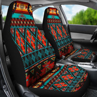 Front car seats covered in multicolor Native American geometric pattern, headrests visible