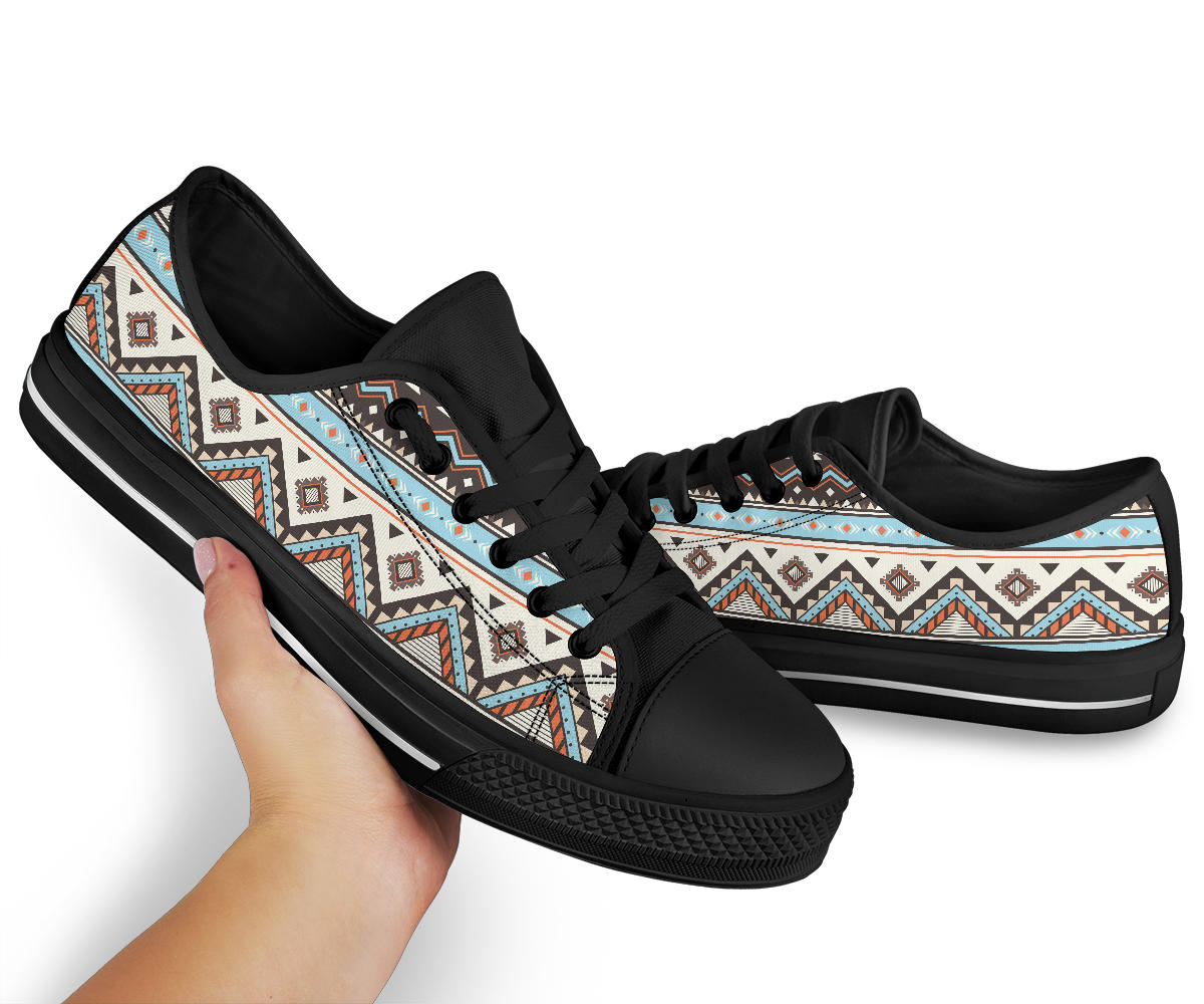 Low-top canvas sneakers with tribal pattern side stripe, black laces, black rubber sole
