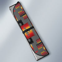 Car side sun shade with gray lining and multicolor tribal geometric pattern, angled view