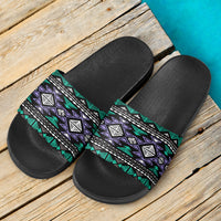Pair of neon tribal slide sandals: textured black footbeds with multicolor patterned straps