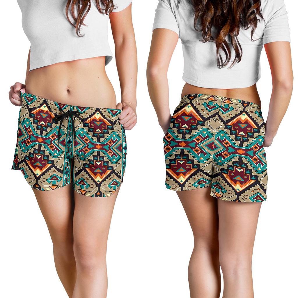 Women wearing tribal print drawstring shorts in teal, tan, and black; mid-thigh length