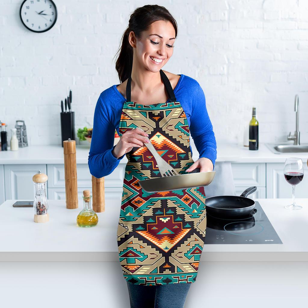 Native American geometric apron in teal and tan with orange accents; front pocket while cooking.