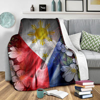 Throw blanket featuring Philippines flag sun, large flowers, and islander patterned edges