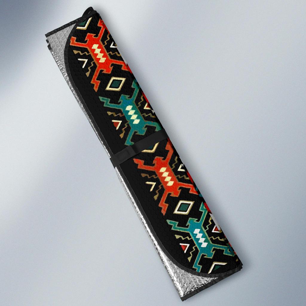 Colorful tribal sun shade angled view with silver reflective backing and black pattern