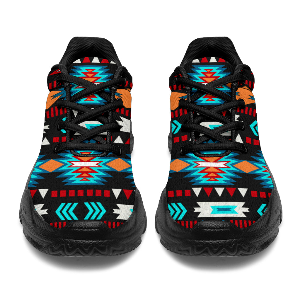 Pair of black chunky lace-up sneakers with neon blue Aztec-style patterns and black soles