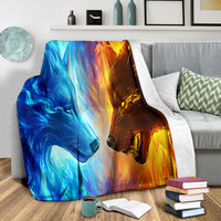 Ice Fire Wolf blanket folded on sofa, blue and orange wolf faces artwork