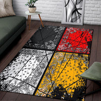 Area rug with black, red, yellow, and white bandana-style patchwork squares