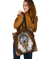 Brown wolf tote bag with long black strap and centered wolf portrait with decorative collar