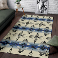 Cream geometric rug with blue center stripe, black zigzag triangles, and floral-like accents