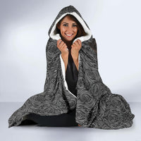 Gray hooded blanket with white-lined hood, wolf swirl pattern