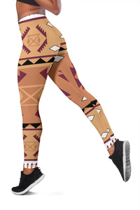 Side view leggings with purple-and-tan tribal print and diamond shapes along thigh